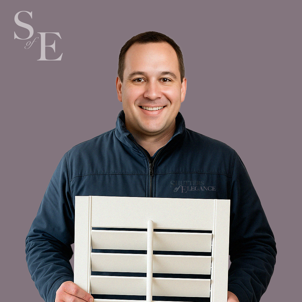 A fitter holding a shutter panel