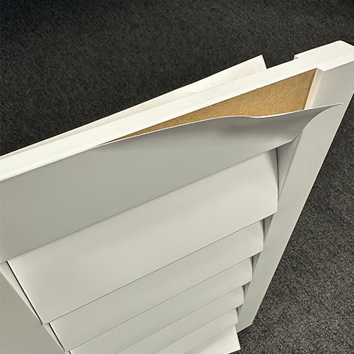 An MDF shutter, heavily water-damaged